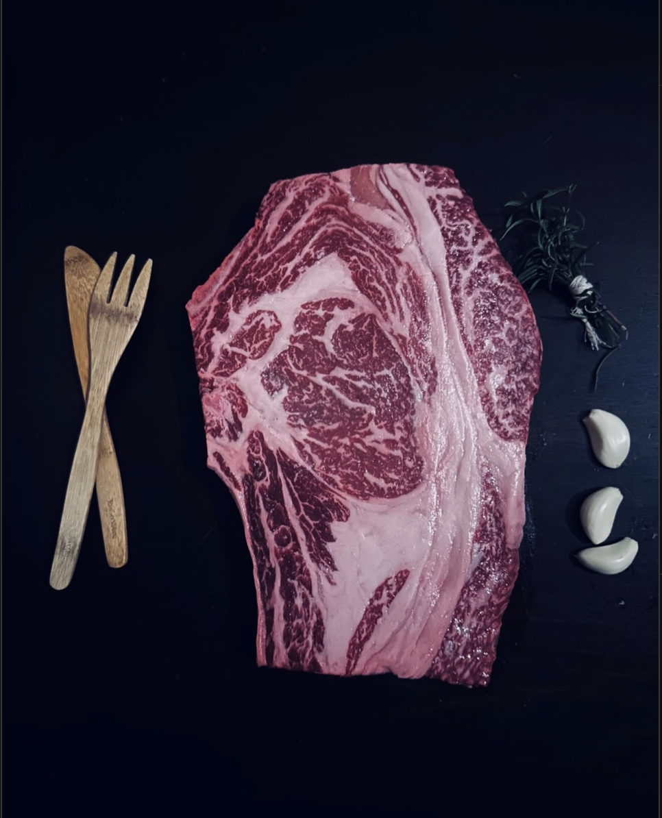 Marbled Miller Wagyu ribeye with garlic and rosemary
